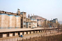 Coal fired cement factory billows smoke, Tongshuan, Shanxi Province, China. March 2009. In 2008 China officially became the worlds largest emitter of greenhouse gases.