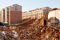 Demolition of house to make way for modern high rise apartment blocks, Suihua, Heilongjiang province, China, March 2009.