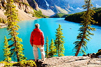 Man looking out over Moraine Lake in the  Banff National Park, Alberta, Canada, August 2012.