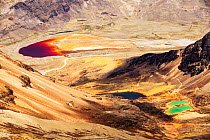 Colourful lakes below the peak of Chacaltaya, lake discoloured by mine effluent., Andes, Bolivia. October 2015.