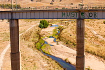 Bridge to cross river which has dried up during the drought which lasted from 1996-2011. Victoria, Australia, February 2010.