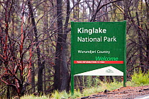Kinglake National Park sign by burnt forest near Kinglake, one of the communities worst affected by the catastrophic 2009 Australian bush fires in the state of Victoria in which 173 people were killed...