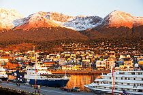 Sunrise over Antarctic expedition ships in the harbour of  Ushuaia,  Tierra del Fuego, Argentina. February 2014.