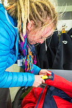 Passengers undergoing bio-security checks on the Akademik Sergey Vavilov  to remove any stray seeds or biological material that might contaminate Antarctica.