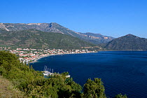 Overview of Tyros harbour and village with the mountains of Arcadia in the background, Peloponnese, Greece, August.