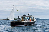 Lobster boat under way. Chebeague Island, Casco Bay, Maine, USA. July 2017.