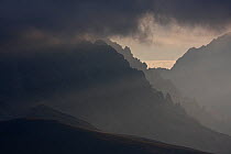 Light filtering through clouds on rugged southern slope of Mount Prena in the Gran Sasso massif. Gran Sasso NP, Central Apennines, Abruzzo, Italy, September.