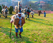 Man in traditional  Zarramaco 'warrior of good' costume,'La Vijanera Carnival, Silio, Cantabria, Spain. January.