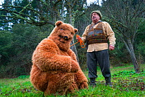 'Bear and Master' characters at Antruido Carnival, Piasca, Libana Valley, Cantabria, Spain.