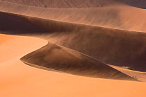 Sand dunes moving in the wind, Sossusvlei,  Namib-Naukluft National Park, Namibia