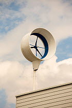 Small scale wind turbine on a house in ijburg, Amsterdam, Holland. May 2013