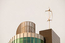 Urban wind turbine on the roof of The Peninsula, a new office development in Manchester, England, UK. January 2010