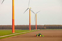 Colourful wind turbines in polders, reclaimed land near Almere, Flevoland, Netherlands. May 2013