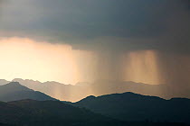 Thunder storm passing over the Langdale Pikes, Lake District, England, UK. May 2012