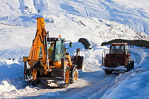 Cumbria County Council clearing snow from the blocked Kirkstone Pass, the highest mountain pass in the Lake District, England, UK. January 2010