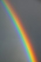 Rainbow and rain shower over Fowey, Cornwall, England, UK. November 2009