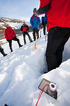 Member of the Scottish Avalanche Information Service demonstrates how to assess avalanche risk on  Cairngorm in the Cairngorm National Park in Scotland UK. February 2009