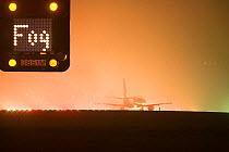 Aeroplane on the runway at East Midlands Airport in foggy conditions. December 2006