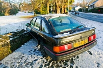 Car which skidded and crashed on ice in Ambleside in the Lake District, England, UK. December 2004