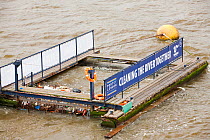 A litter trap on the River Thames, London, UK. January 2000