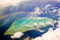 Aerial view of rainbow over tropical reef near Tuvalu, Pacific Ocean,  March 2007
