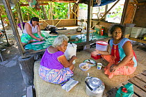 Tuvaluan family having breakfast on Funafuti atol Tuvalu. March 2007
