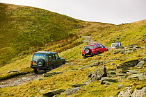 Off road vehicles on the Walna Scar road above Coniston in the Lake District, UK. November 2004