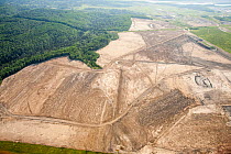 Soil  removed to reach the tar sands beds in an open pit tar sands mine north of fort McMurray, Alberta, Canada. August 2012