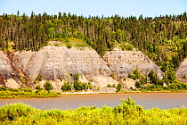 Tar sands deposits exposed in the side of the Athabasca River, Fort McMurray, Alberta, Canada. August 2012