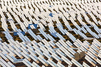 Heliostats reflecting sunlight onto solar tower at Ivanpah Solar Thermal Power Plant, the largest solar thermal plant in the world. It covers 4,000 acres of desert and produce 392 megawatts (MW) of el...