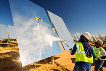 Workers washing the heliostats to maximise reflective power at the Ivanpah Solar Thermal Power Plant,  the largest solar thermal plant in the world. It covers 4,000 acres of desert and produce 392 meg...