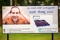 An advert for a solar water heater in  a park in Bangalore, India. December 2013