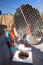 Women constructing solar cookers at the Barefoot College in Tilonia, Rajasthan, India. The Barefoot College is a worldwide charity, founded by Bunker Roy, its aims are, education, drinking water, elec...