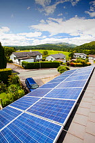 Solar PV panels on a house roof in Ambleside, Lake District, UK. July 2012