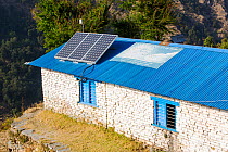 Solar photo voltaic panels on the rooftops of a school in Ladruk in the Himalayan foothills, Nepal. December 2012