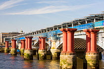 Blackfriars Bridge across the River Thames in London, UK, is the world's largest solar bridge. Its parapet contains over 4400 solar photo voltaic panels, generating 50% of the stations electricity nee...