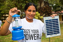 Solar lantern powered by a solar panel, part of a display to promote renewable energy in Karnataka, India. December 2013
