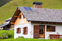 Solar panels on a visitor centre in the Vallon de la Lex Blanche below Mont Blanc, Alps, Italy. August 2014