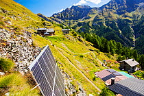 Solar panels attached to a cliff above the Refuge Bertone, which provied electricity to this off grid mountain hut. Tour du Mont Blanc, Alps, Italy. August 2014