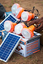 Solar lamps charging by solar panels, in the refugee camp of Chiteskesa refugee camp, near Mulanje. March 2015