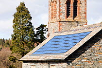 Solar electric panels on Lowick Village Hall in South Cumbria, UK. March 2011