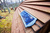 Camping pods powered by small solar panels at Lagganlia, Feshiebridge, Cairngorm, Scotland, UK. March 2012