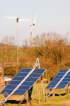 Solar panels and wind turbines on a farm near Woodhouse Eaves in Leicestershire, UK. March 2012