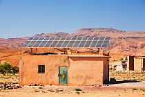 Solar panels on a house roof in a Berber village in the Anti Atlas mountains of Morocco, North Africa. April 2012