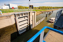Canal going from the sea to the reclaimed polder land in Holland, north of Amsterdam, which is some 20 feet lower than the sea. With 50% of the Netherlands below sea level, it is incredibly vulnerable...