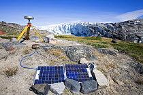 Scientist using GPS equipment measuring the speed of the Russelll Glacier near Kangerlussuag, Greenland, July 2008