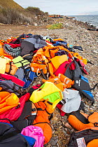 Life jackets and remains of boats left by Syrian migrants, refugees fleeing the war. Lesvos Island, Efthalou, Greece. September.