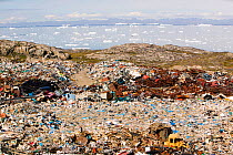 Rubbish dumped on the tundra outside Illulissat, Illulissat ice fjord Unesco World Heritage Site, Greenland, July 2008