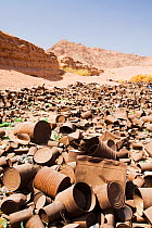 Tin cans discarded in the mountains of the Sinai desert near Dahab, Egypt. October 2008