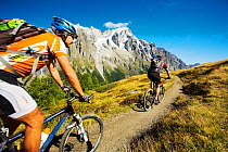 Mountain bikers on Mont de la Saxe above Courmayeu, Italy. August 2014
